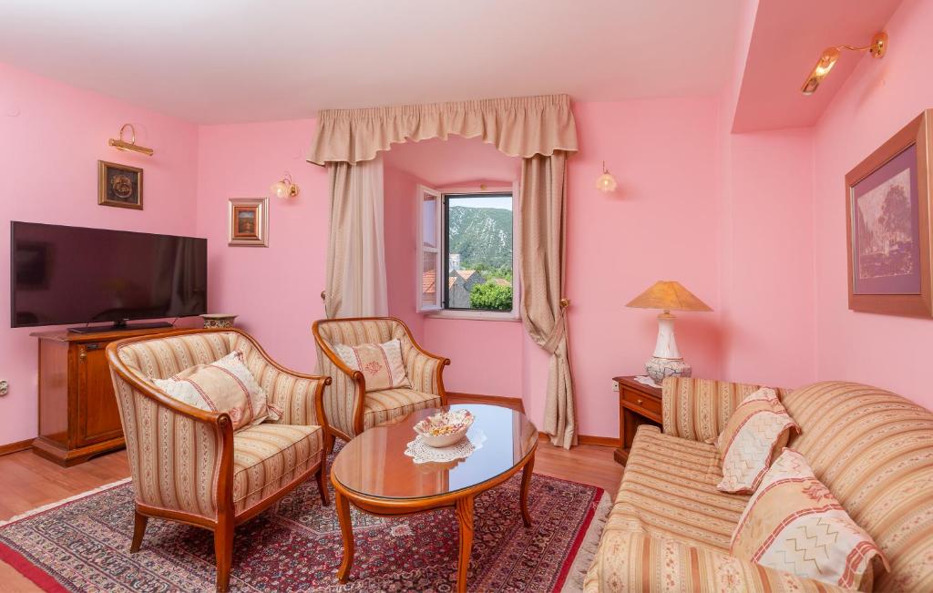 TV a/nebo společenská místnost v ubytování Hotel Ostrea