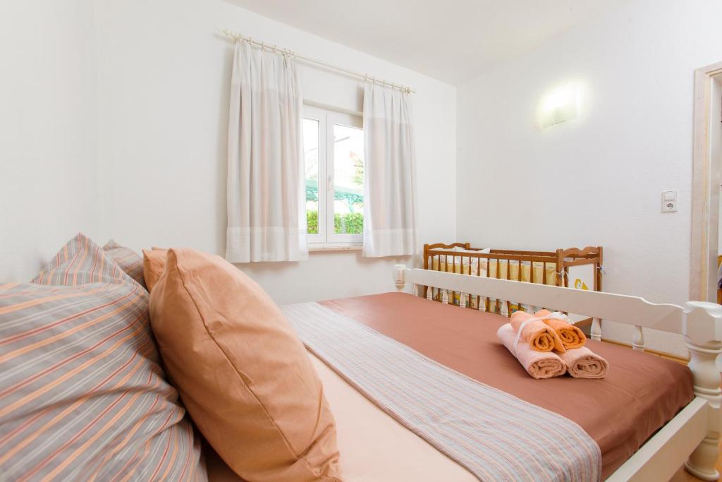 Postel nebo postele na pokoji v ubytování Pansion Mlikota