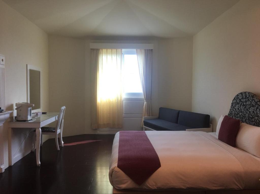 Postel nebo postele na pokoji v ubytování Harmony Ocean Hotel