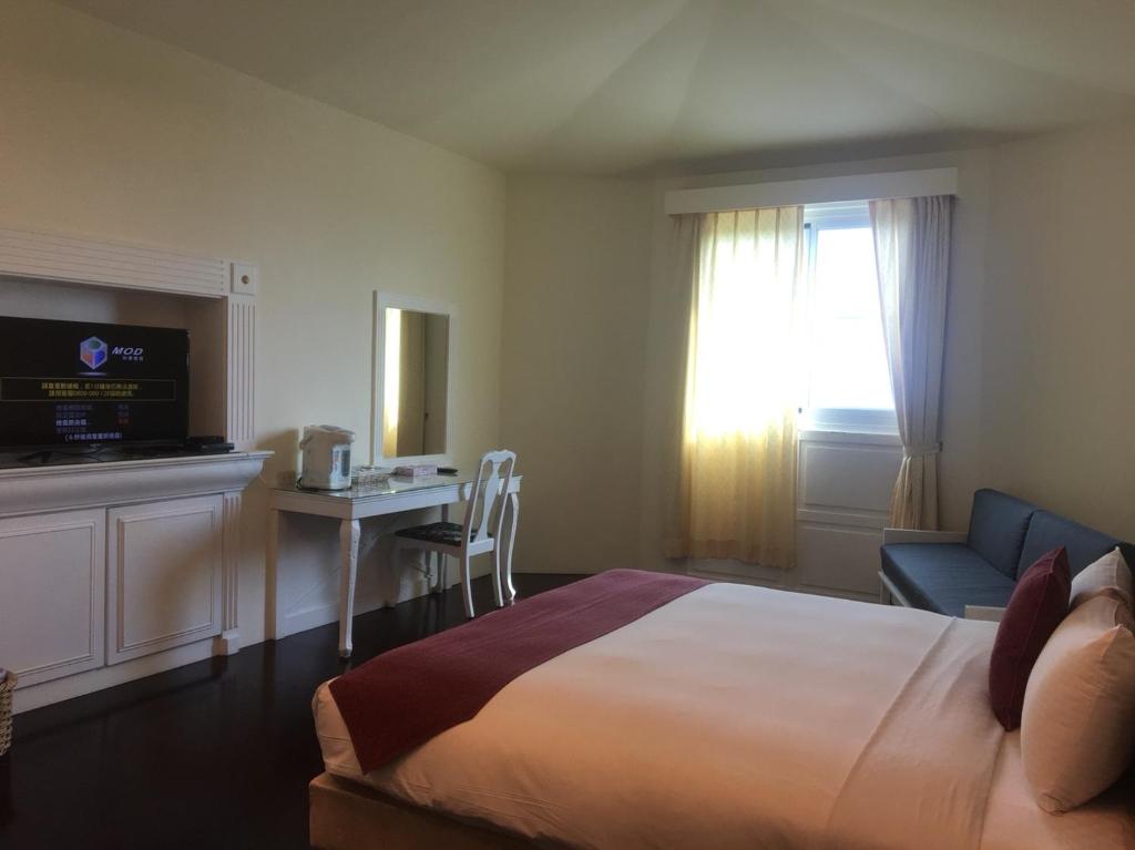 TV a/nebo společenská místnost v ubytování Harmony Ocean Hotel