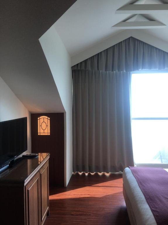 Postel nebo postele na pokoji v ubytování Harmony Ocean Hotel