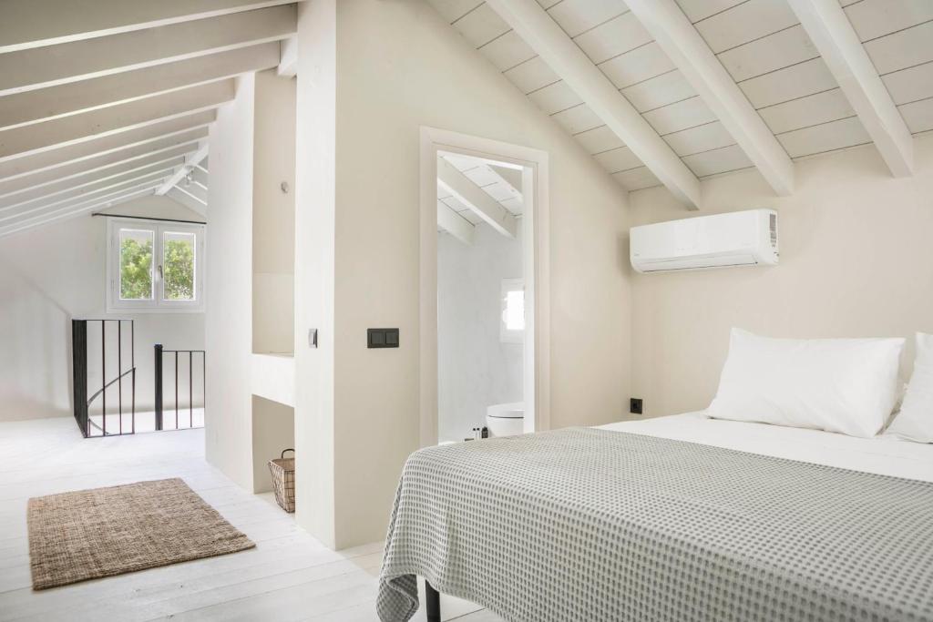 Ένα ή περισσότερα κρεβάτια σε δωμάτιο στο Kymata Bohemian Villas