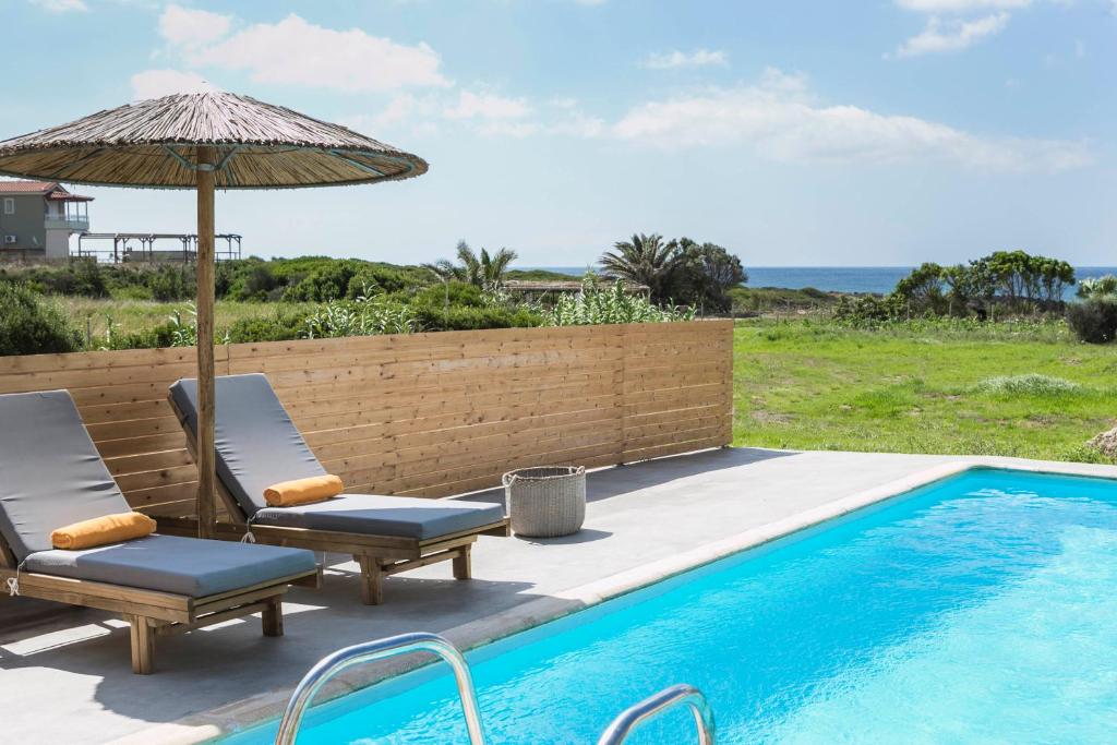 Πισίνα στο ή κοντά στο Kymata Bohemian Villas