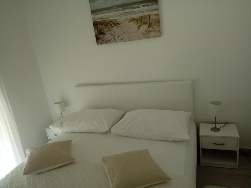 Postel nebo postele na pokoji v ubytování Sweet Apartments