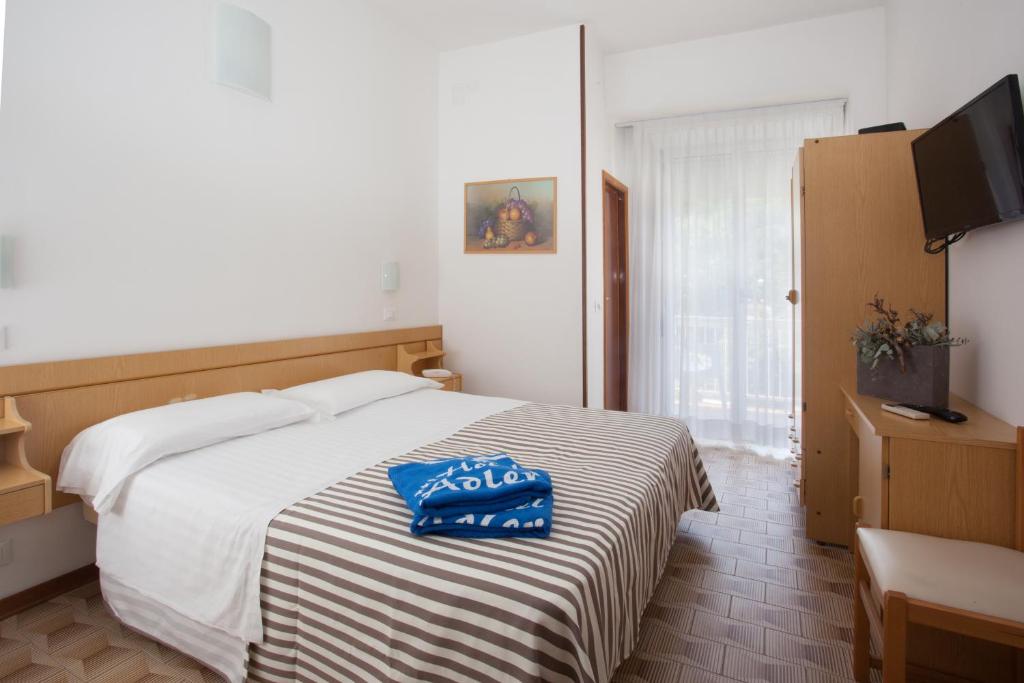 Postel nebo postele na pokoji v ubytování Hotel Adler
