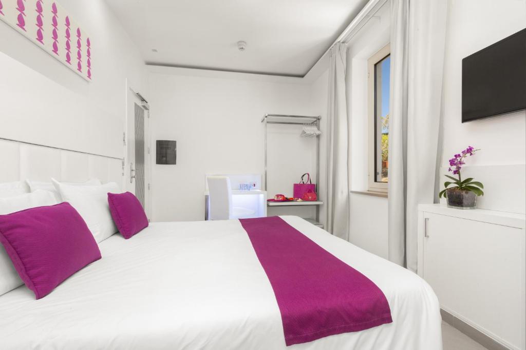Postel nebo postele na pokoji v ubytování Hotel Tasso Suites & Spa