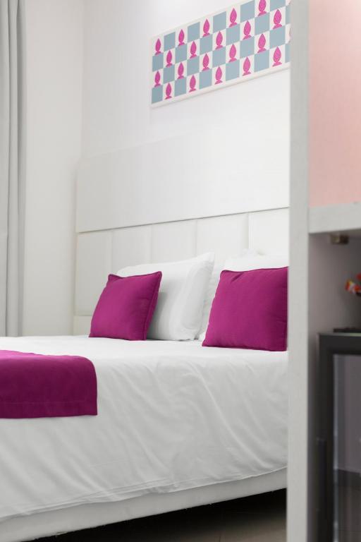 Postel nebo postele na pokoji v ubytování Hotel Tasso Suites & Spa
