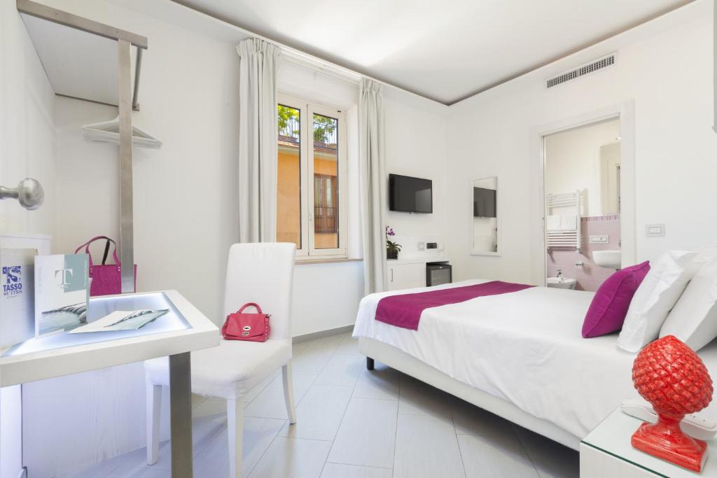 Postel nebo postele na pokoji v ubytování Hotel Tasso Suites & Spa