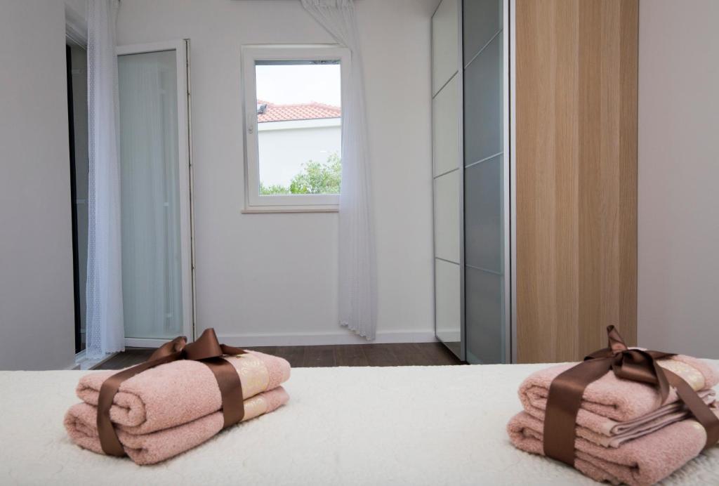 Postel nebo postele na pokoji v ubytování Apartments Lanterna