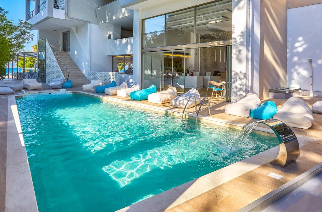 a swimming pool in the middle of a house at Triton Boutique Hotel in Kos Town