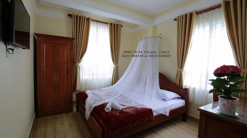 Postel nebo postele na pokoji v ubytování Bình Đào Hotel - Khách sạn ngay trung tâm giá rẻ