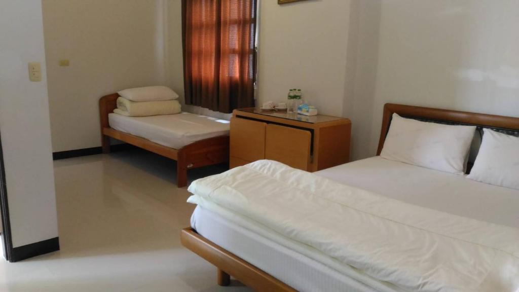 Postel nebo postele na pokoji v ubytování Flower Memory Homestay