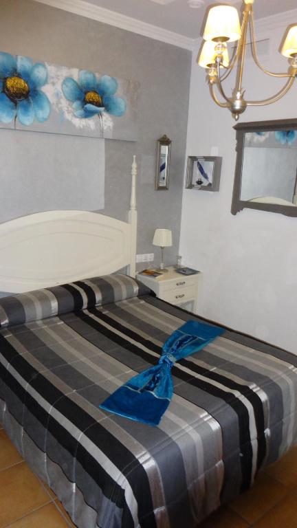 Postel nebo postele na pokoji v ubytování La Posada Del Infante
