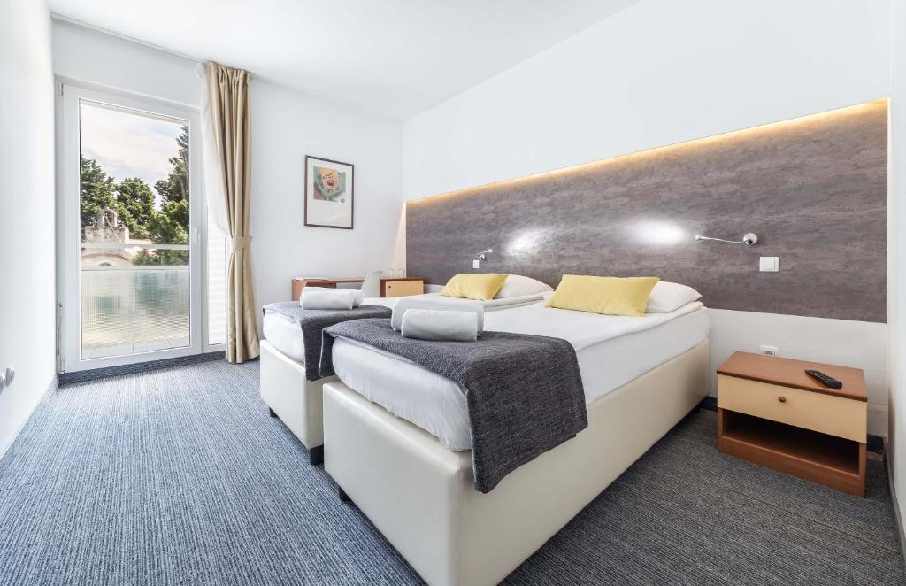 Posteľ alebo postele v izbe v ubytovaní Hotel Punta