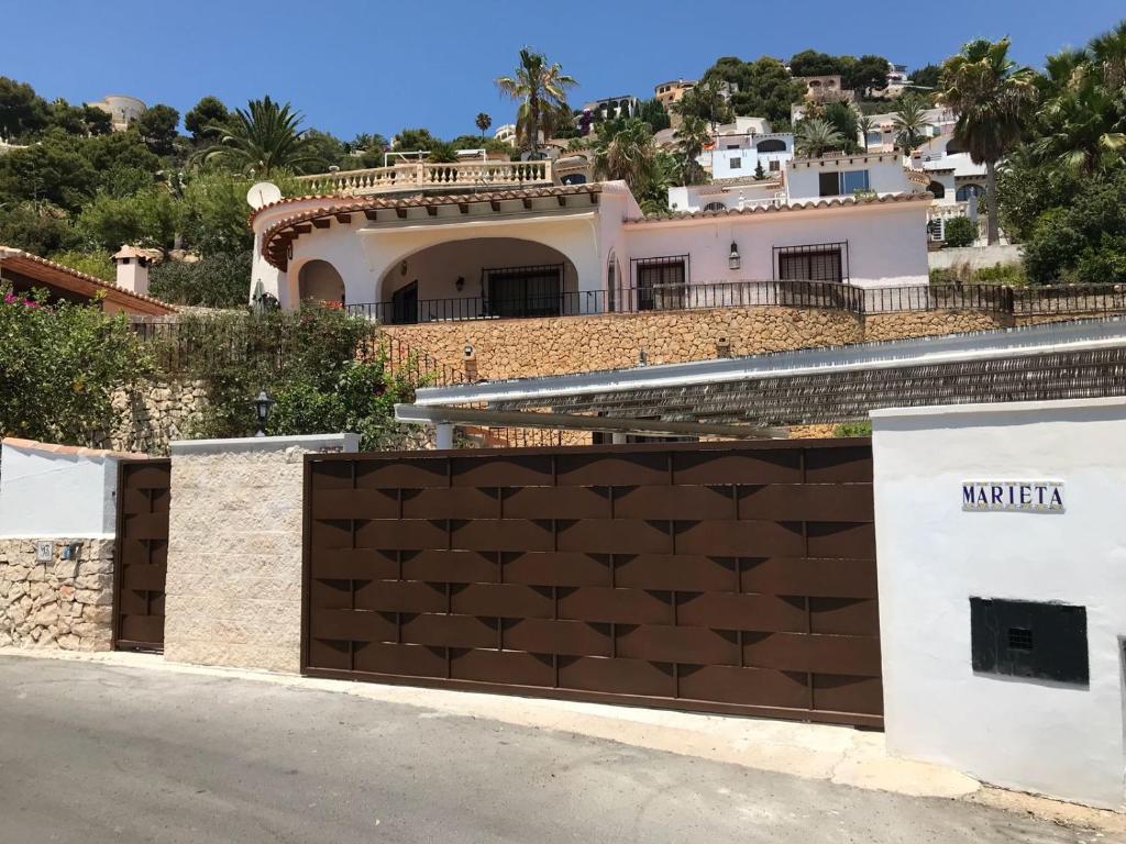 a fence in front of a house at Casa Marieta in Benissa