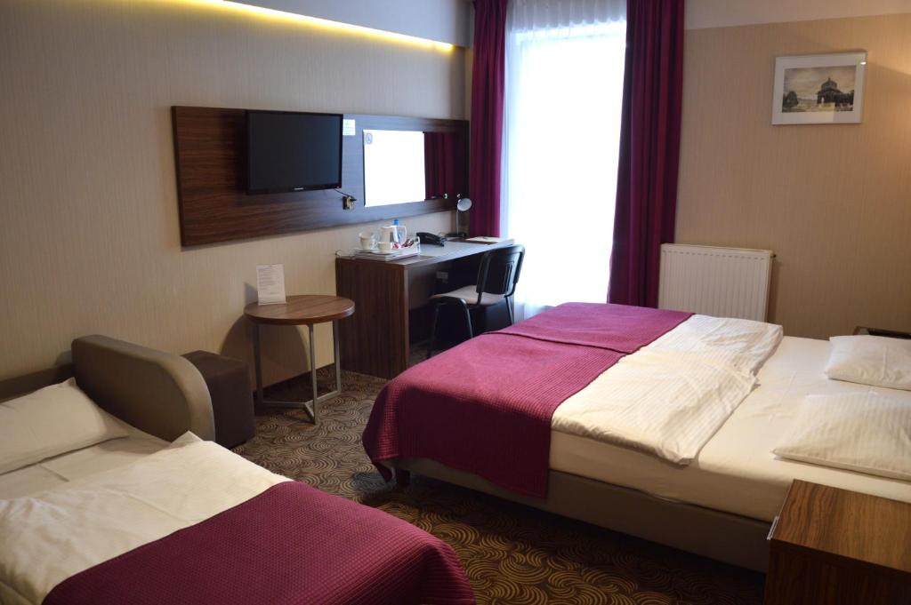 Postel nebo postele na pokoji v ubytování Hotel Silver