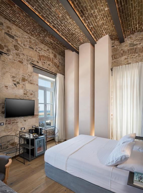 Posteľ alebo postele v izbe v ubytovaní Ambassadors Residence Boutique Hotel