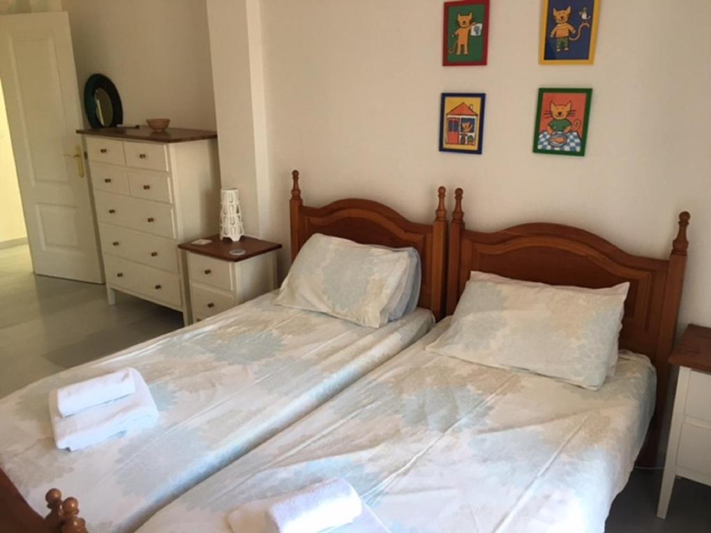 Postel nebo postele na pokoji v ubytování Villa El Gallo