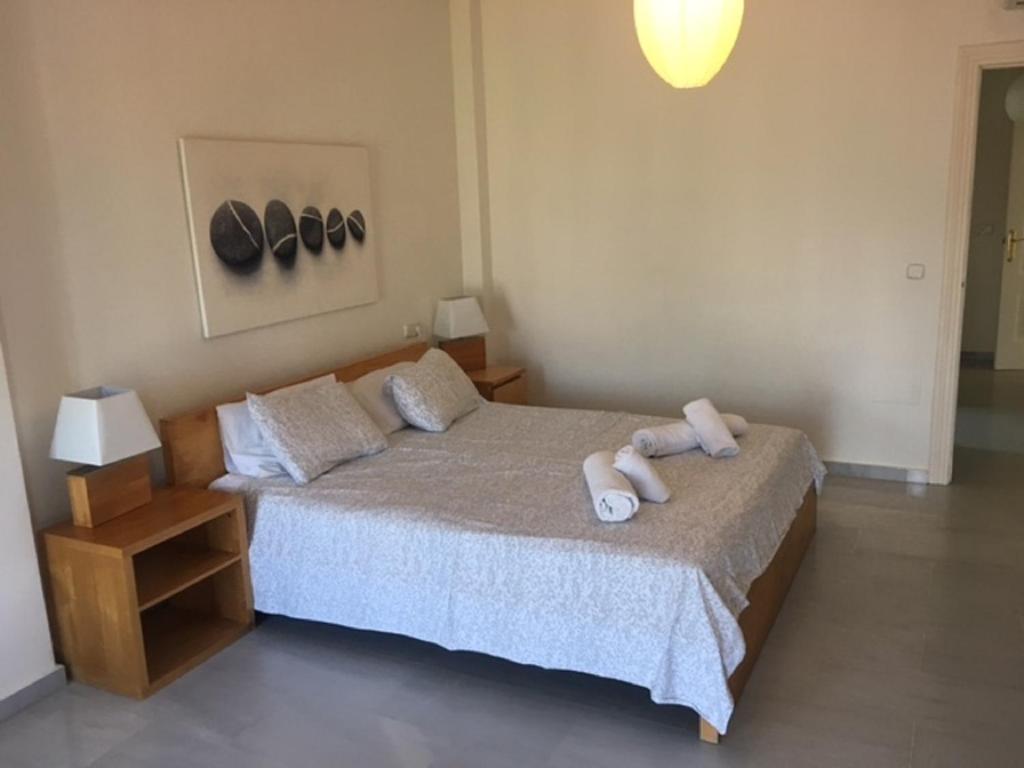 Postel nebo postele na pokoji v ubytování Villa El Gallo