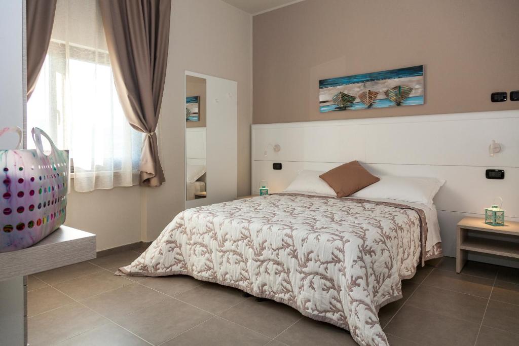 Posteľ alebo postele v izbe v ubytovaní Riviera HUB