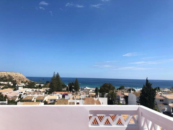 a view of a city from the balcony of a house at Luz Paradise in Luz