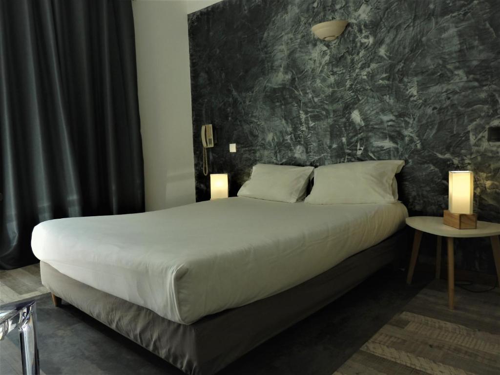 Postel nebo postele na pokoji v ubytování Hotel Marengo