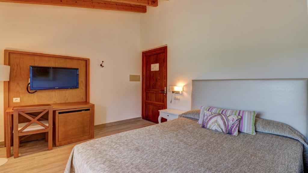 Кровать или кровати в номере Hoposa Costa D'or - Adults Only