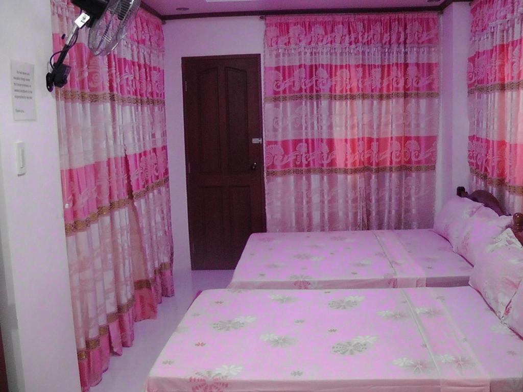 Postel nebo postele na pokoji v ubytování Mary Chiang Baguio Transient House