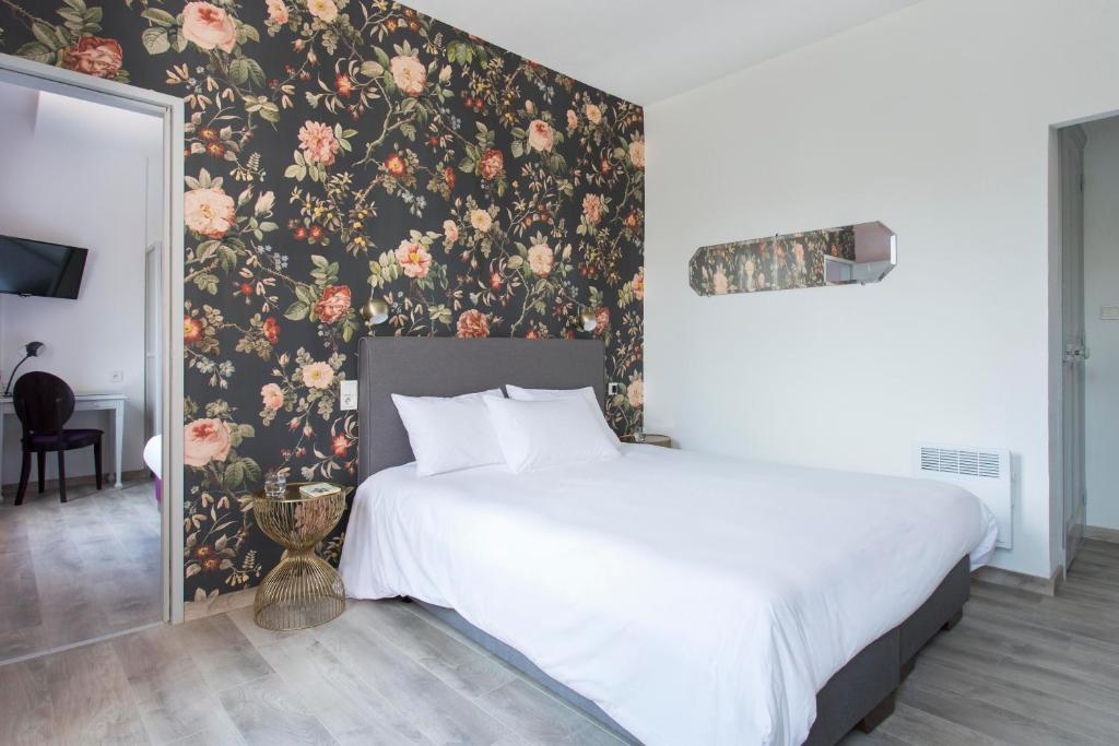 Postel nebo postele na pokoji v ubytování Hôtel d'Angleterre