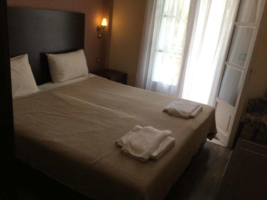 A bed or beds in a room at Villa Vasso