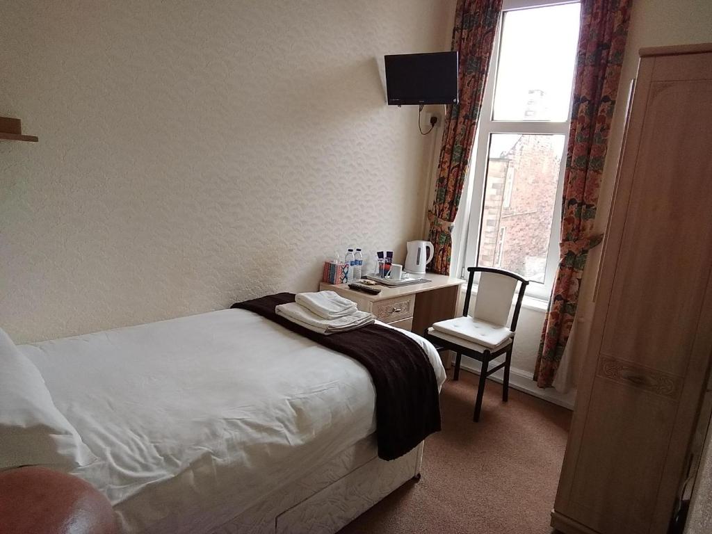 Postel nebo postele na pokoji v ubytování Lindean Guest House