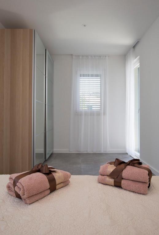 Postel nebo postele na pokoji v ubytování Apartments Lanterna