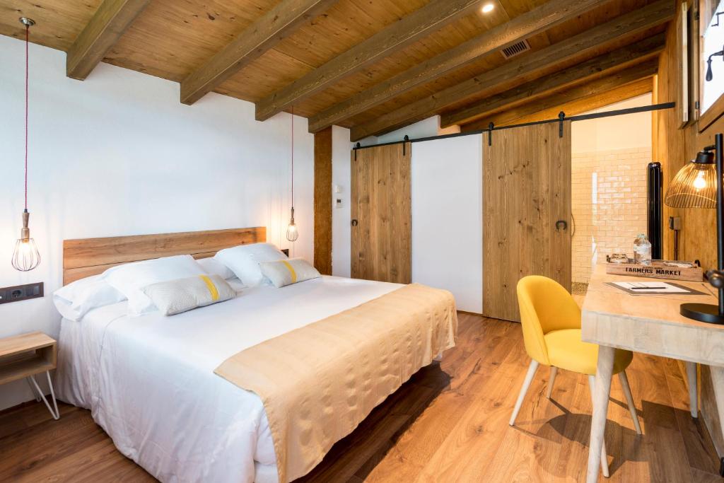 Postel nebo postele na pokoji v ubytování Hotel Mas la Ferreria