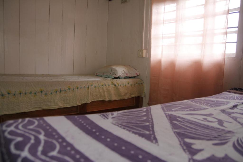 Letto o letti in una camera di Vamoose Gomethang Homestay