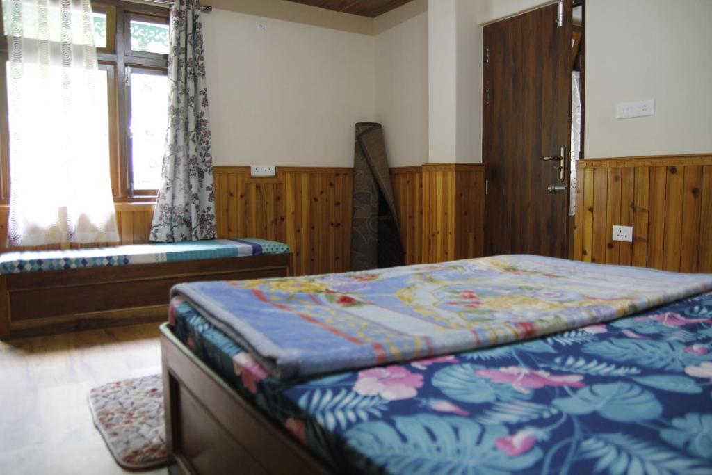 Letto o letti in una camera di Vamoose Gomethang Homestay