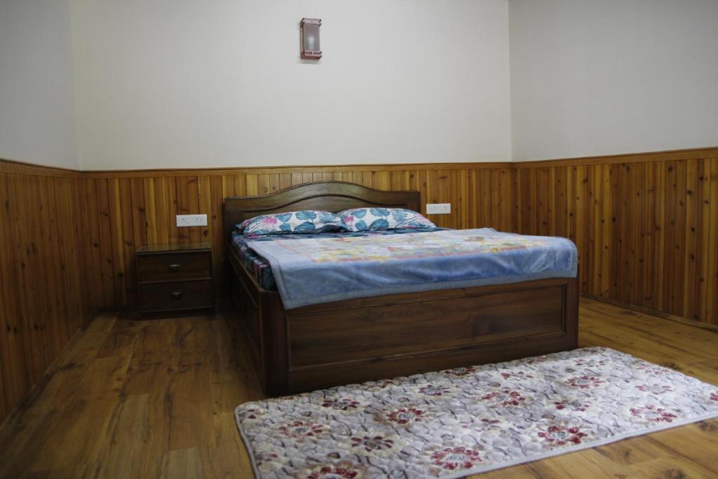Letto o letti in una camera di Vamoose Gomethang Homestay