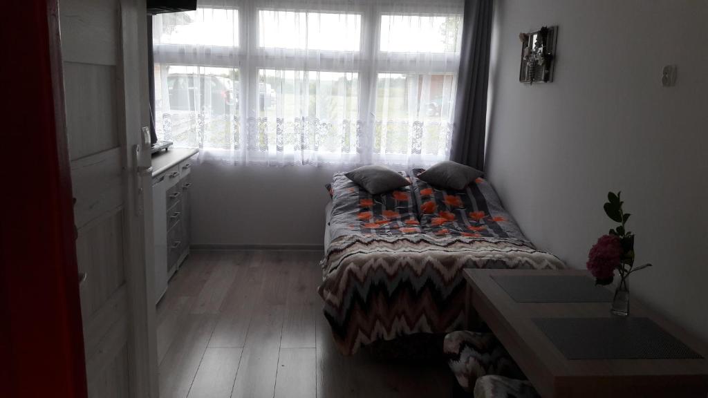 Postel nebo postele na pokoji v ubytování Leszkowo
