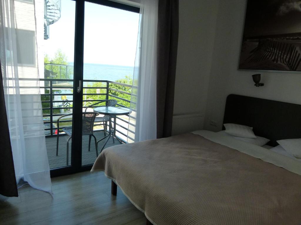 Łóżko lub łóżka w pokoju w obiekcie Dom Przy Plaży