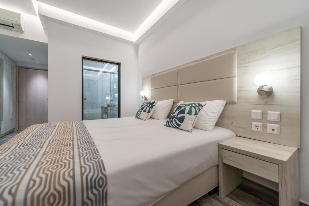 Postel nebo postele na pokoji v ubytování Mandala Seafront Suites