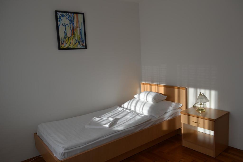 Katil atau katil-katil dalam bilik di Leier Business Hotel