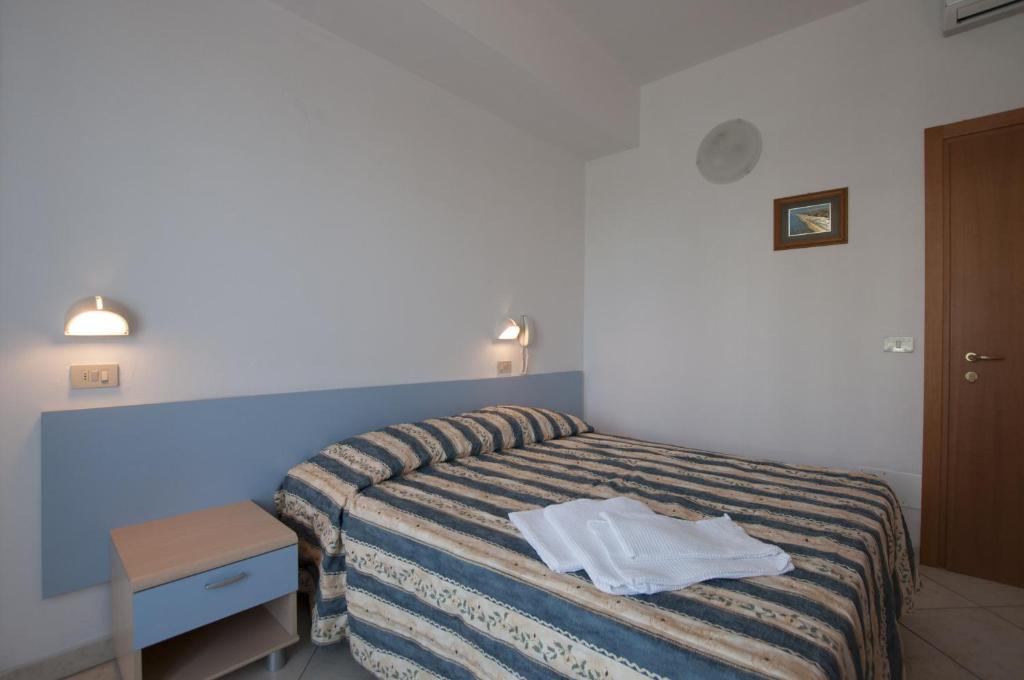 Postel nebo postele na pokoji v ubytování Hotel Edelweiss