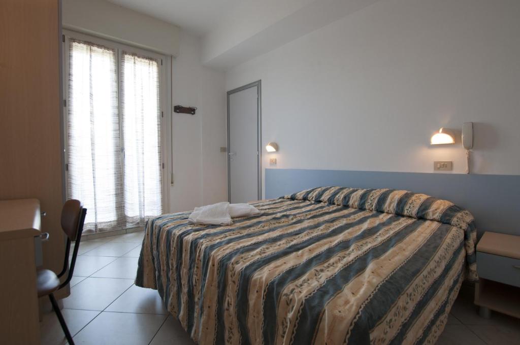 Postel nebo postele na pokoji v ubytování Hotel Edelweiss