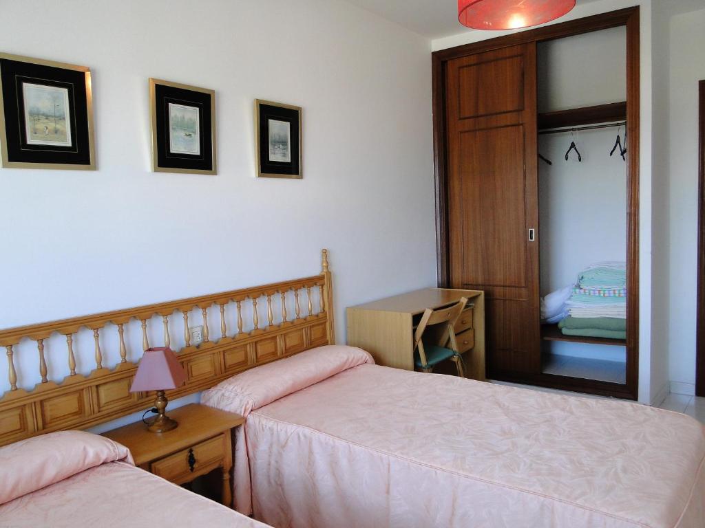 Posteľ alebo postele v izbe v ubytovaní Apartamentos Blanco