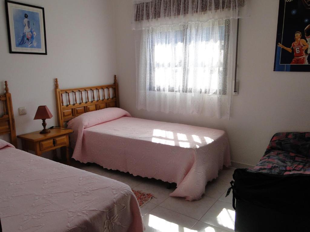 Posteľ alebo postele v izbe v ubytovaní Apartamentos Blanco