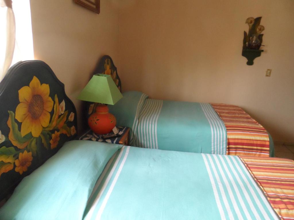 Postel nebo postele na pokoji v ubytování Hotel Internacional Malitsin