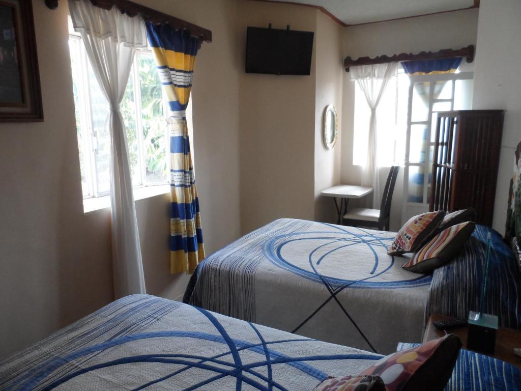 Postel nebo postele na pokoji v ubytování Hotel Internacional Malitsin