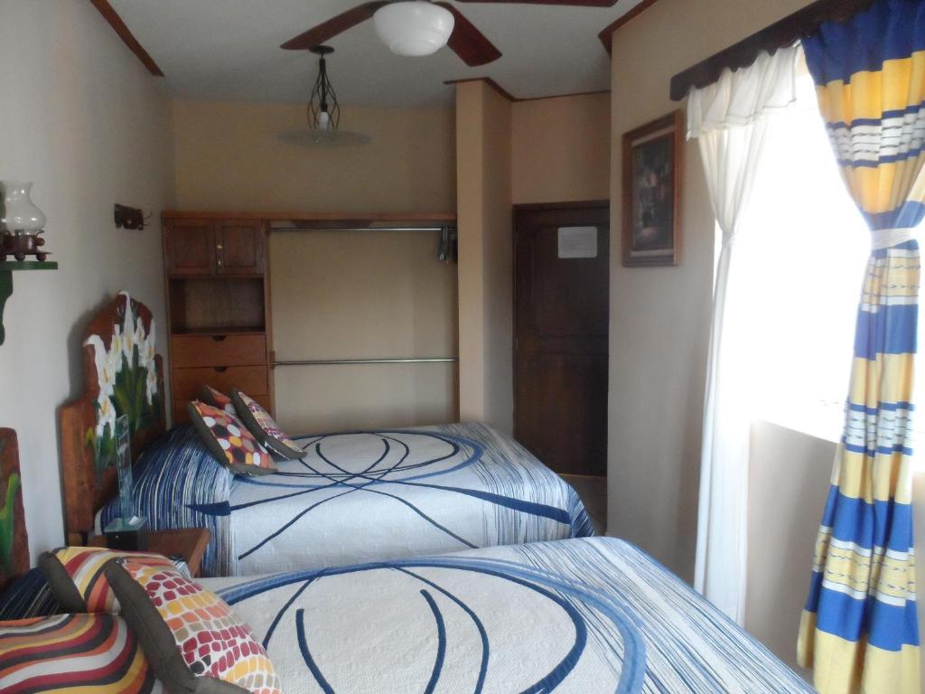 Postel nebo postele na pokoji v ubytování Hotel Internacional Malitsin