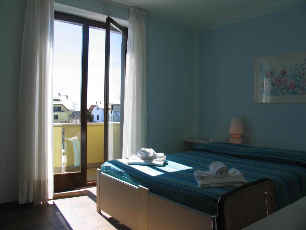 Postel nebo postele na pokoji v ubytování Albergo Residence Isotta