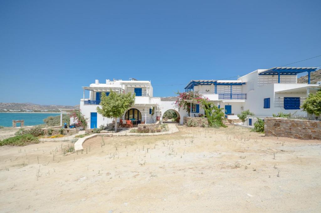 a house on the beach with the ocean in the background at Orkos Blue Coast in Mikri Vigla