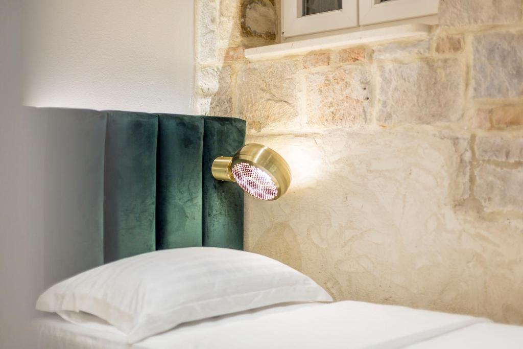 Postel nebo postele na pokoji v ubytování Miara Luxury Rooms